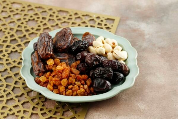 Snack for Sweet Takjil Iftar Moslem Ramadan Month, Pistachio, Dates Fruit, and Golden Raisin.